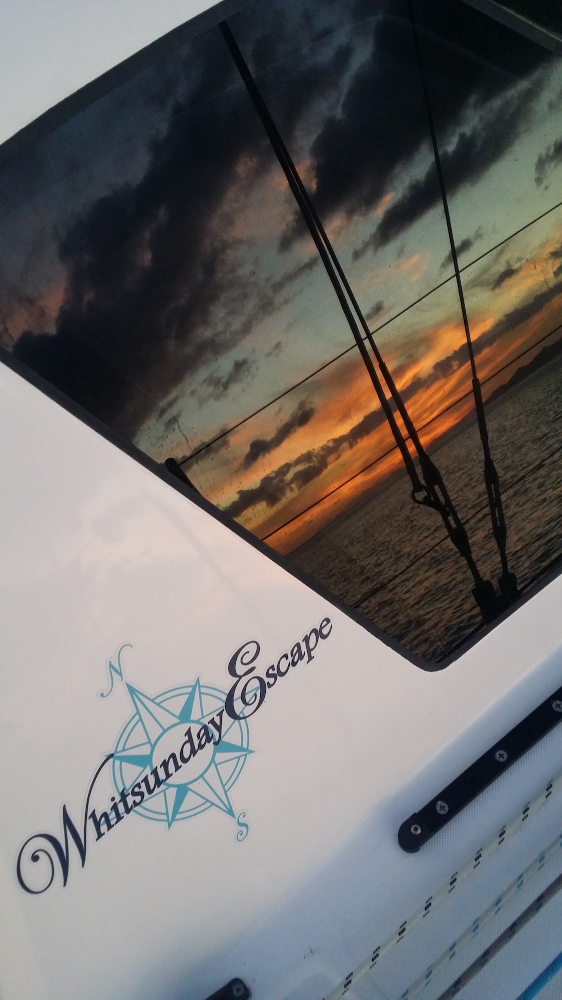 sunset reflection in Whitsunday Escape Seawind 1160 3 Lite sailing catamaran