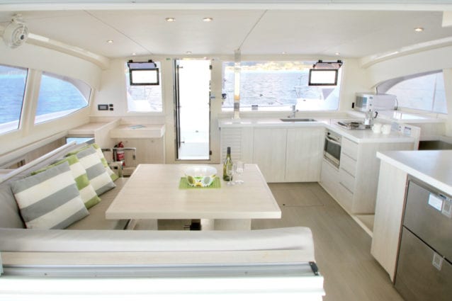 https://whitsundayescape.com.au/wp-content/uploads/2016/05/Whitsunday-Escape-Leopard-401-saloon-galley-and-forward-door.jpg