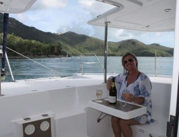 Whitsunday Escape Leopard 44 sailing catamaran cockpit fwd sunset drinks cheers