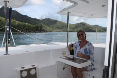 Whitsunday Escape Leopard 44 sailing catamaran cockpit fwd sunset drinks cheers