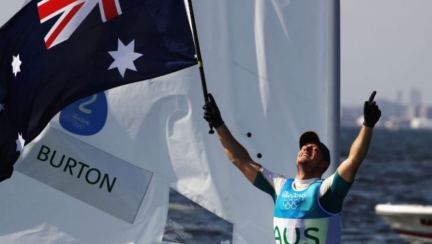 Tom Burton gold medal olympics laser dinghy sailing race winner. Getty images