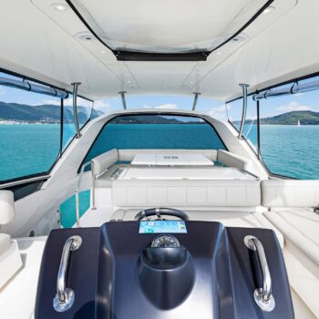 The flybridge of the Aquila 44.3 Power Catamaran with a view of the Whitsundays in the background