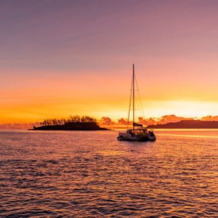Sailing Catamaran anchored looking into the sunset