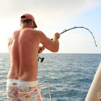 Man catching a fish on Whitsunday skipper yourself holiday