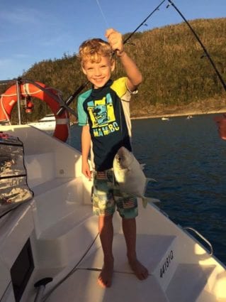 Boy fishing family holiday in the whitsundays - Whitsunday Escape™
