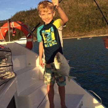 Kid fishing in Whitsundays on Family Bareboating Holiday - Whitsunday Escape™