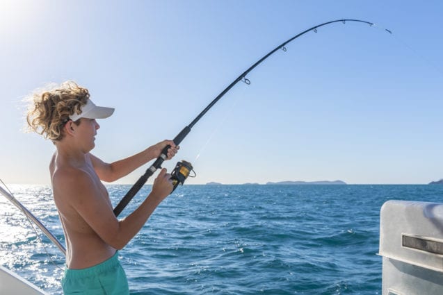 Riptide Creative Whitsunday Escape™ Boy Fishing on family holiday adventure