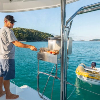 Whitsunday Escape Man using BBQ on back deck