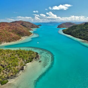 A drone image above a reef inlet in the Whitsundays